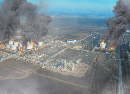 Collage. Fire at the refinery. Flames and smoke of fire.